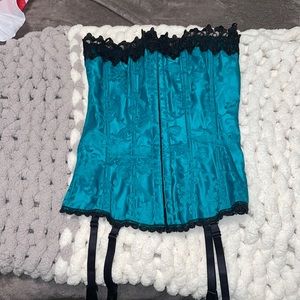 Teal Frederick’s of Hollywood corset top lace up in the back